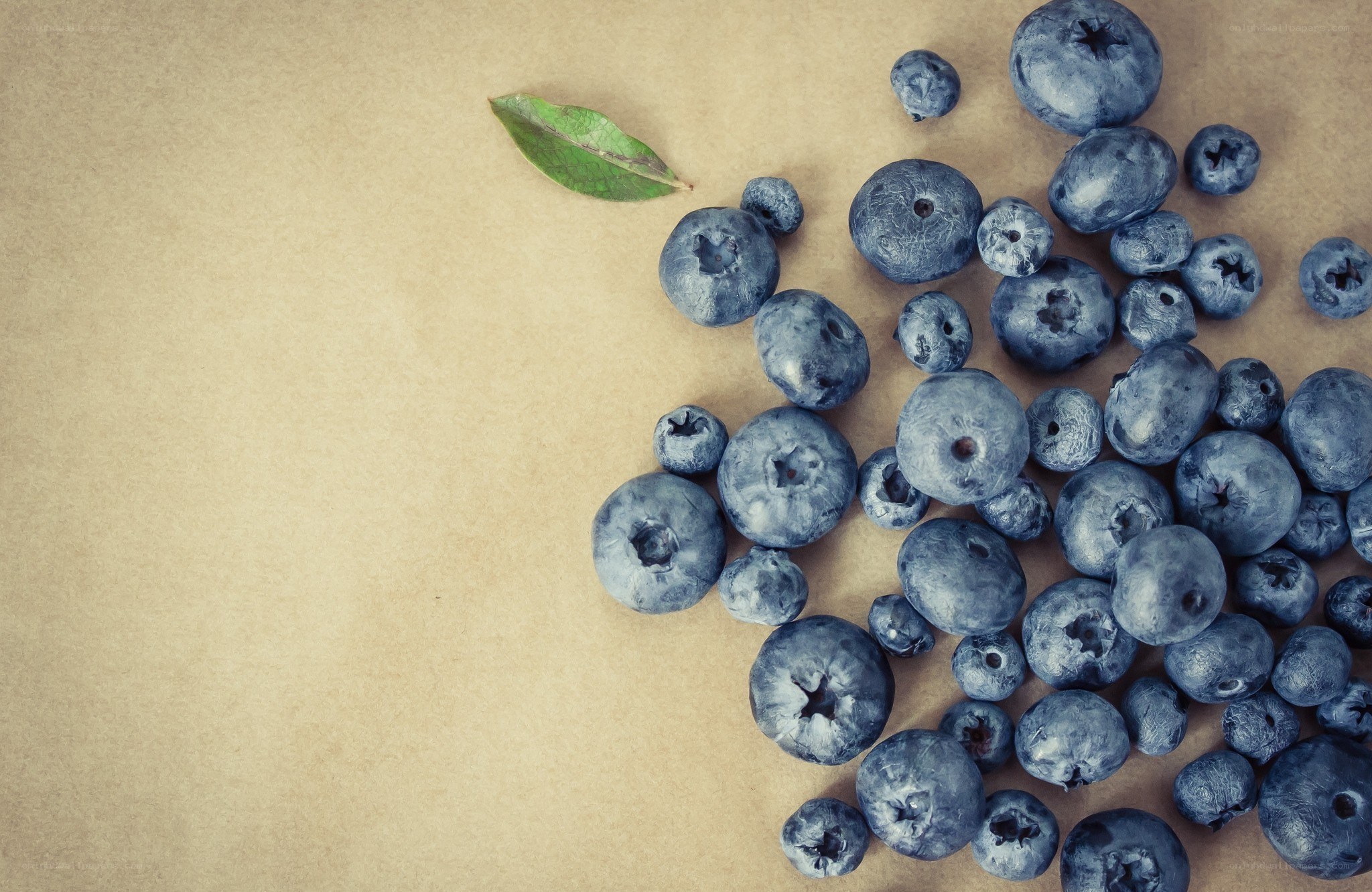 blueberries on brown paper