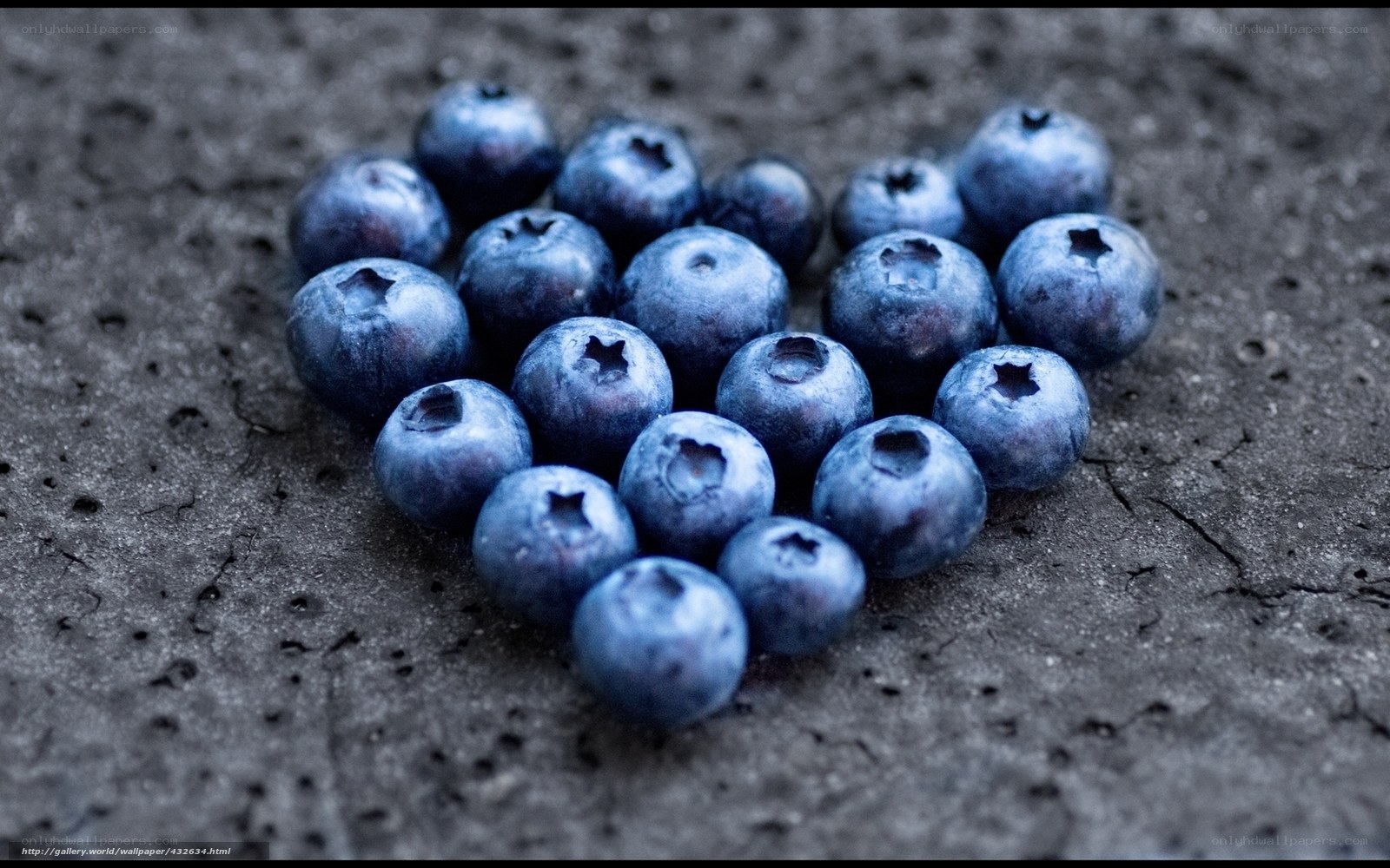 blueberries on dark surface