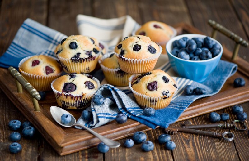 Blueberry muffins on a wooden tray