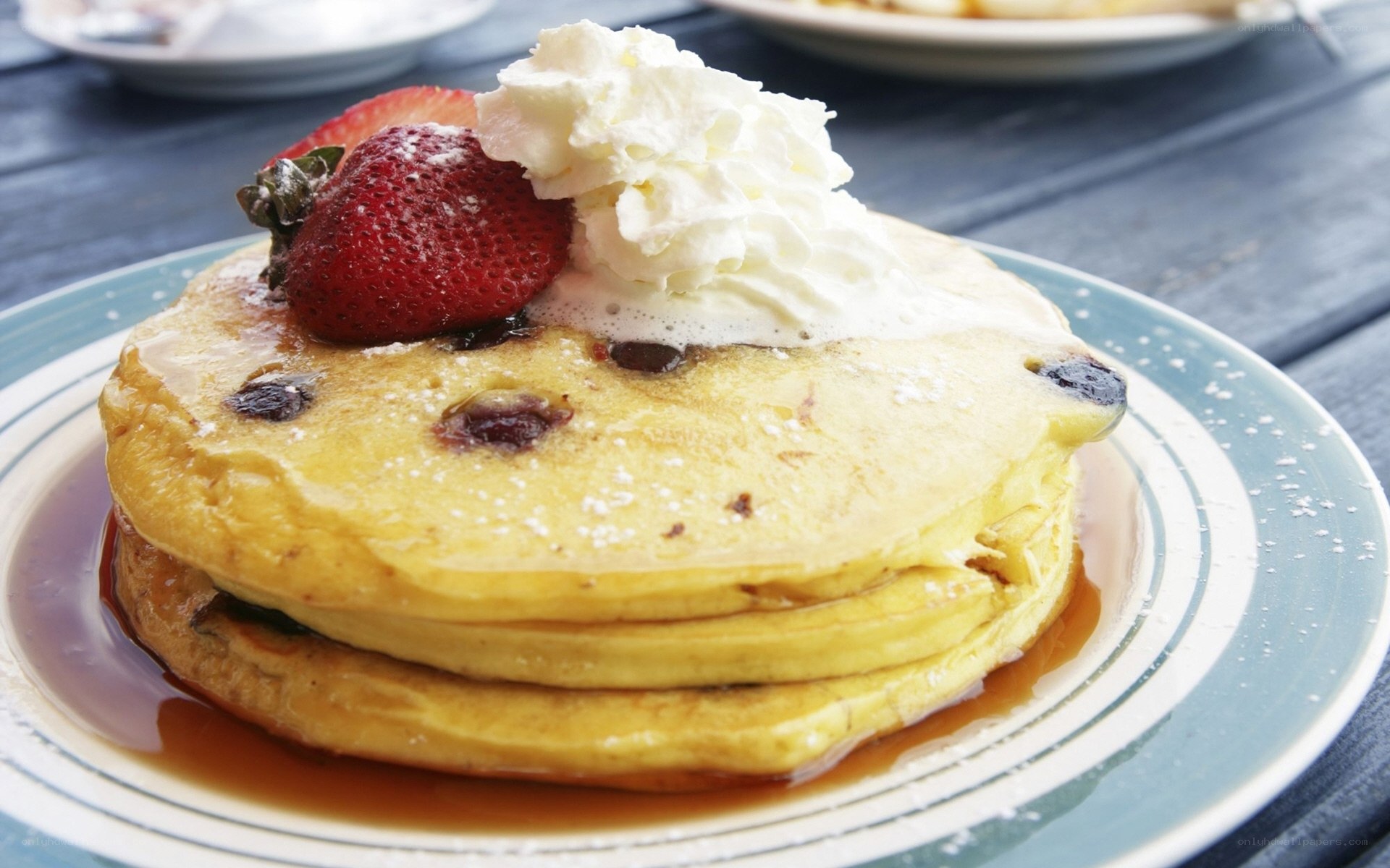 Blueberry pancakes with whipped cream