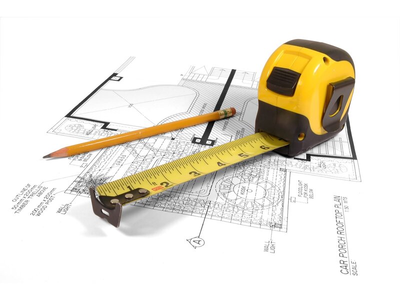 Blueprint with tape measure and pencil