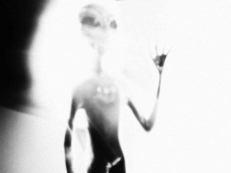 Blurred Alien Figure
