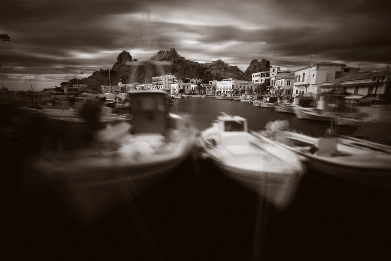 Blurred boats in a coastal harbor