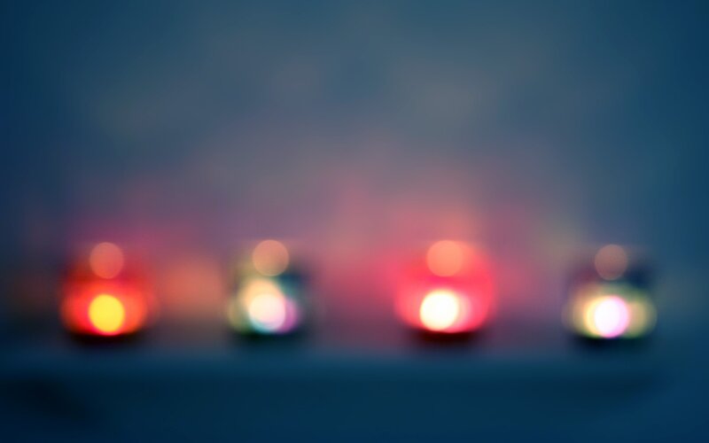 blurred candles in darkness