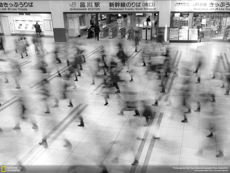 Blurred Commuters in Station