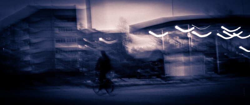Blurred cyclist at night