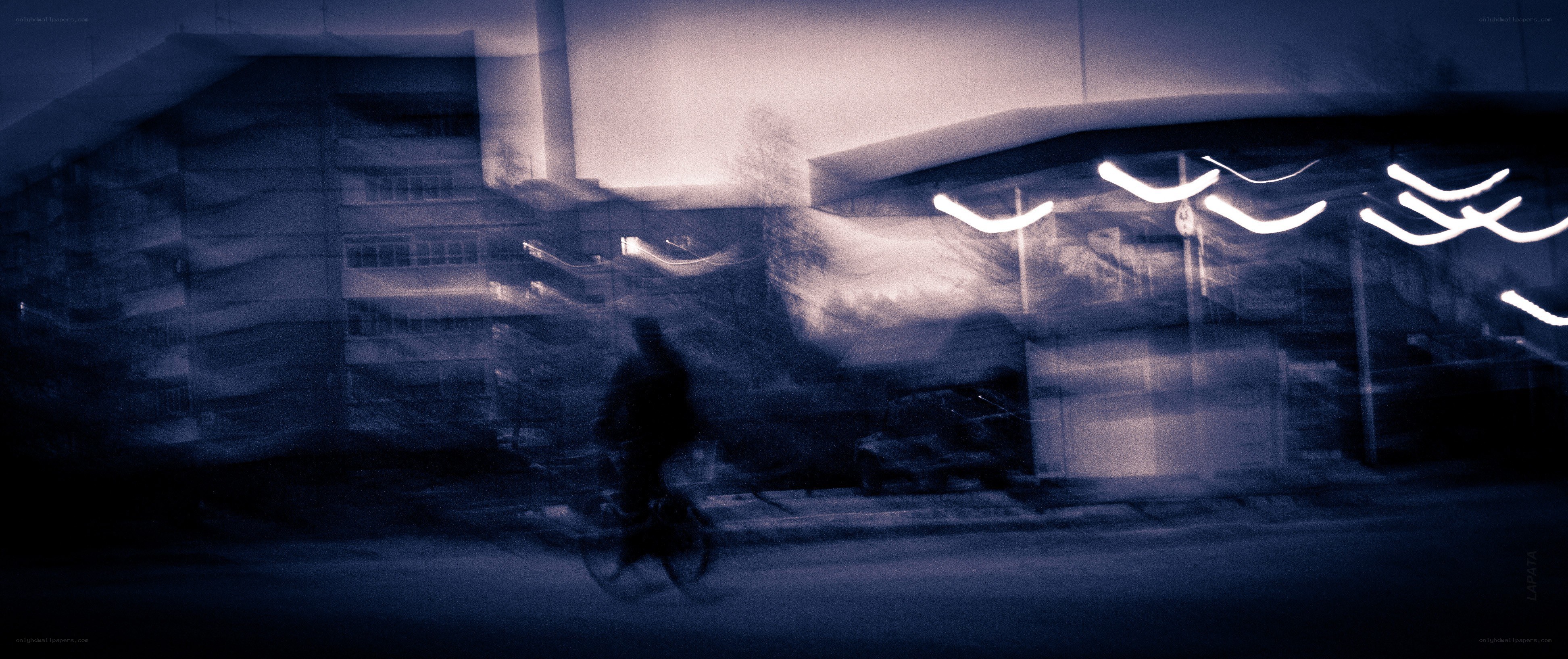 Blurred cyclist at night