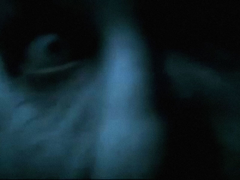 Blurred Face in Dark Light