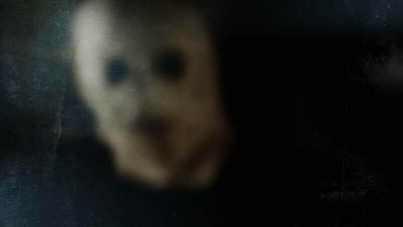 Blurred Face in Dark Room