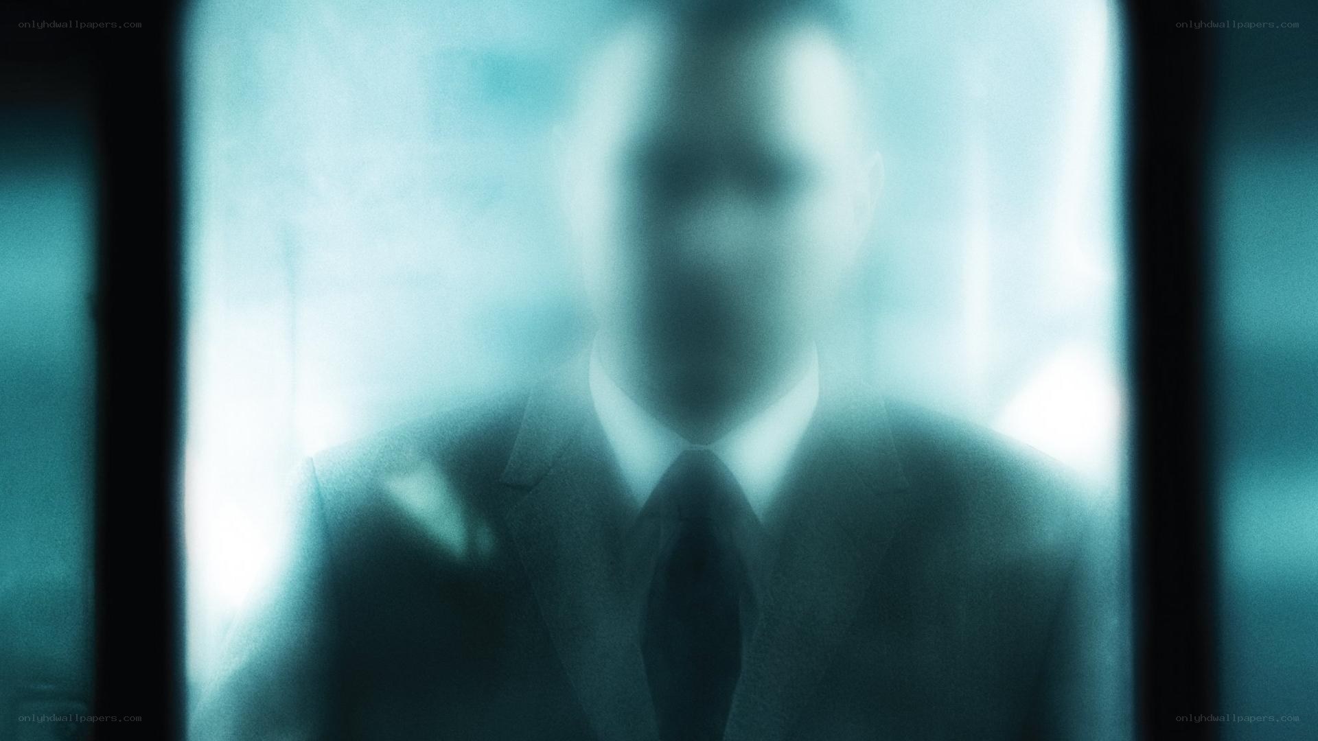 blurred figure in suit
