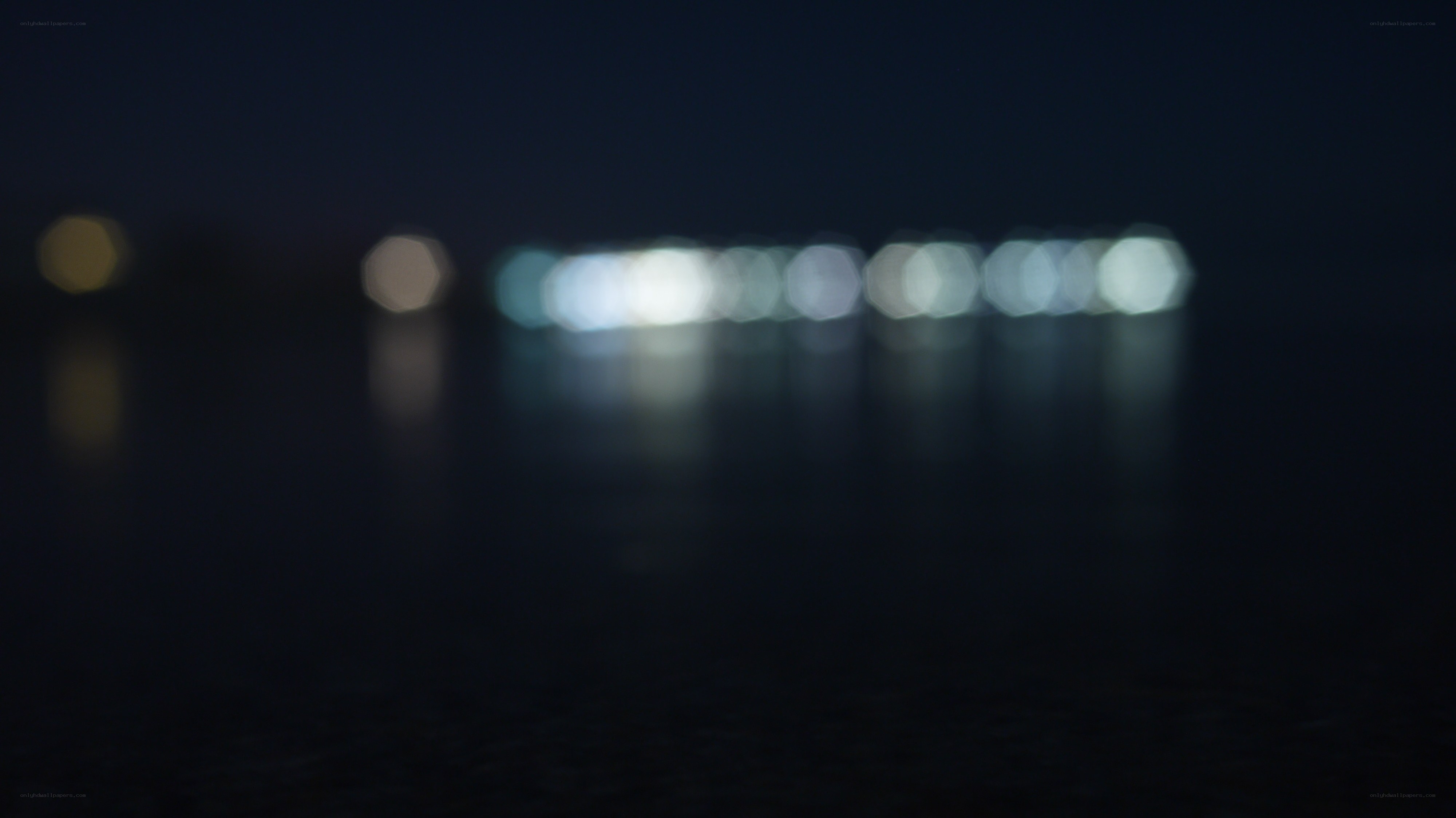 blurred lights on water at night
