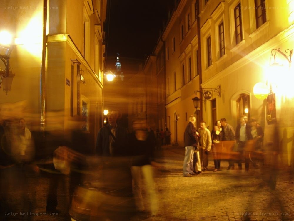 Blurred night on a cobblestone street