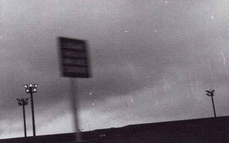Blurred Sign and Lights — Black, Dramatic