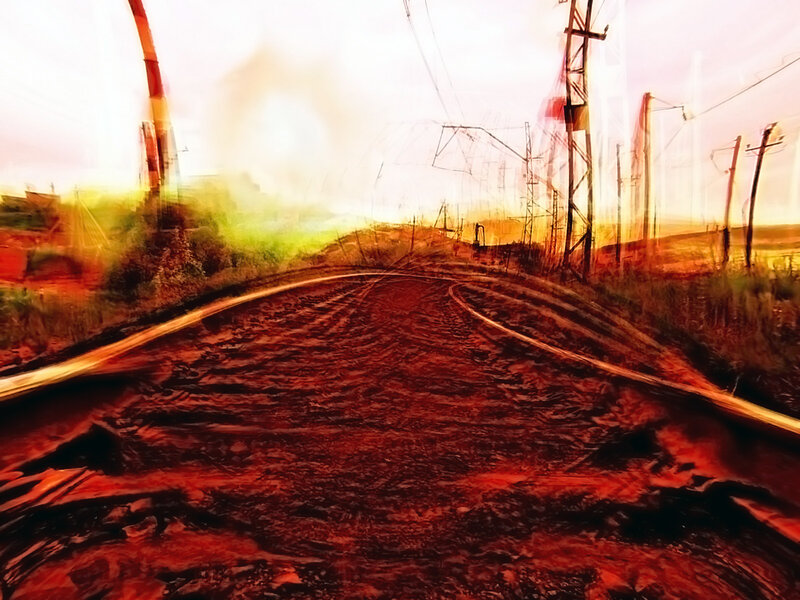 Blurred train tracks at sunset