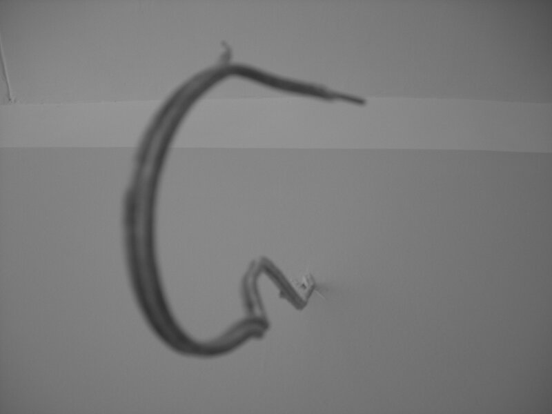 Blurred wire against wall