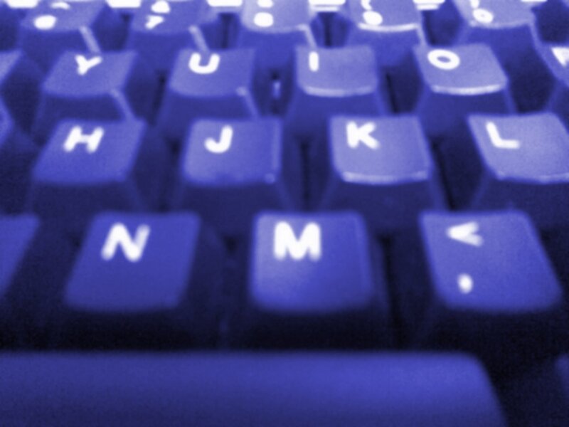 blurry blue keyboard close-up