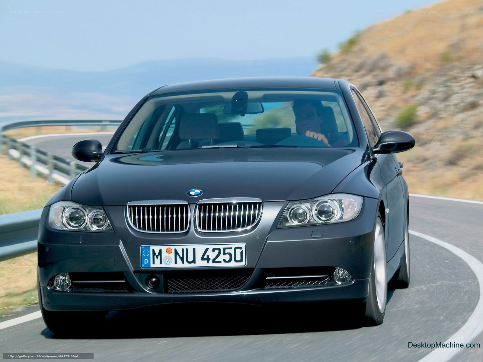 BMW 3 Series driving on a winding road