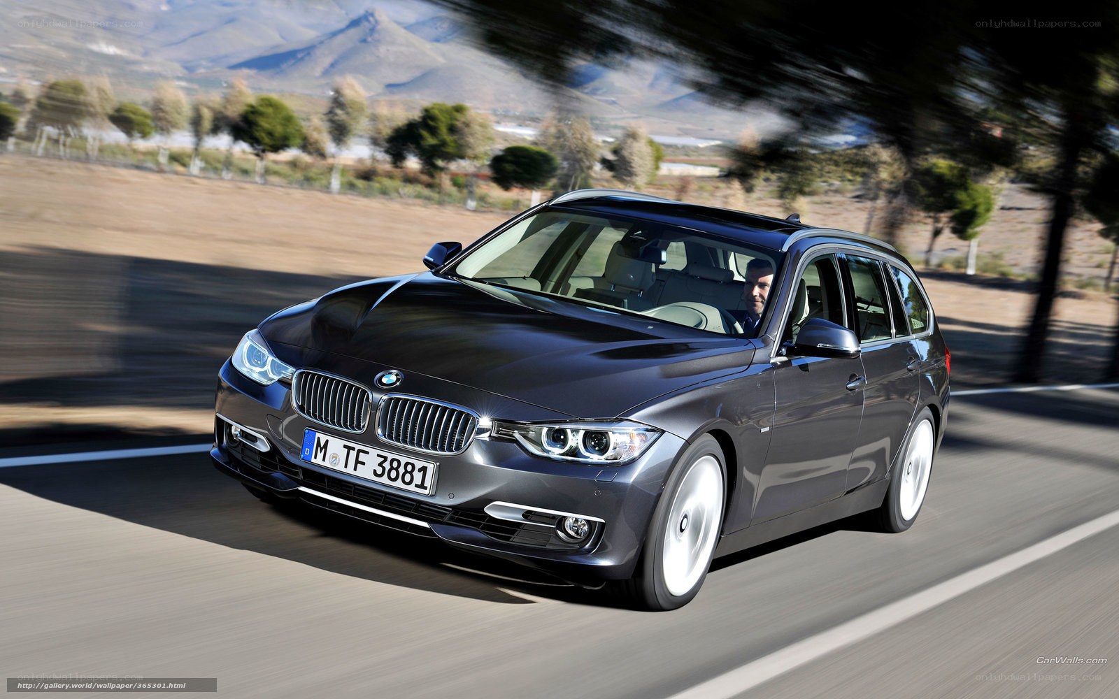 BMW 3 Series Wagon on a scenic road