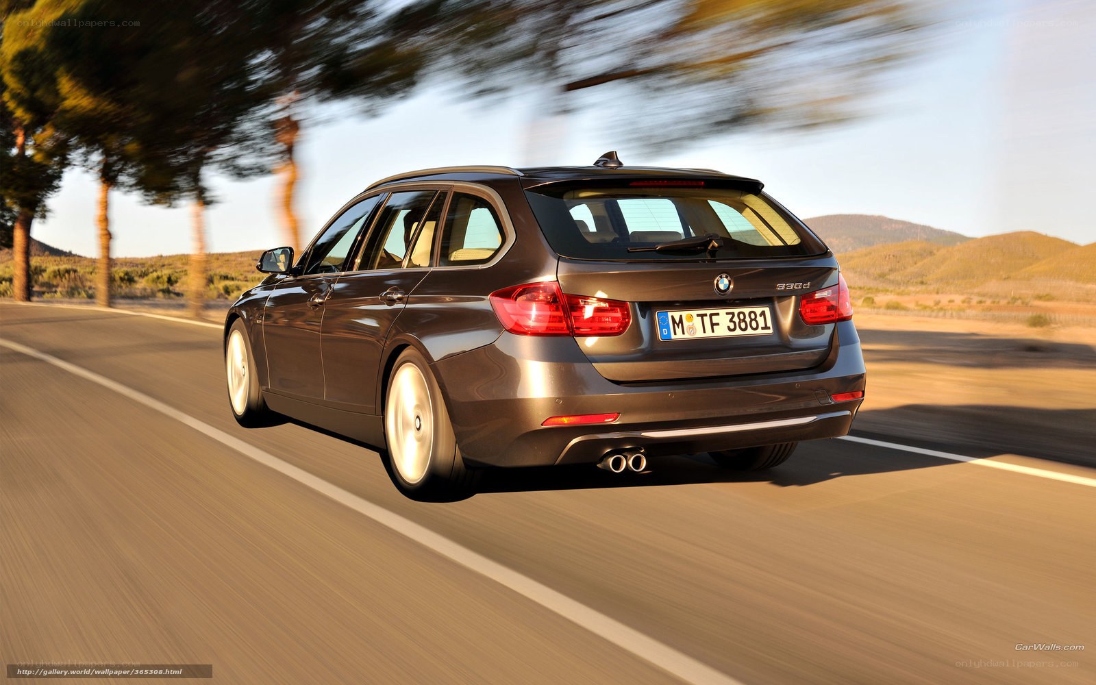 BMW 330d driving on a road