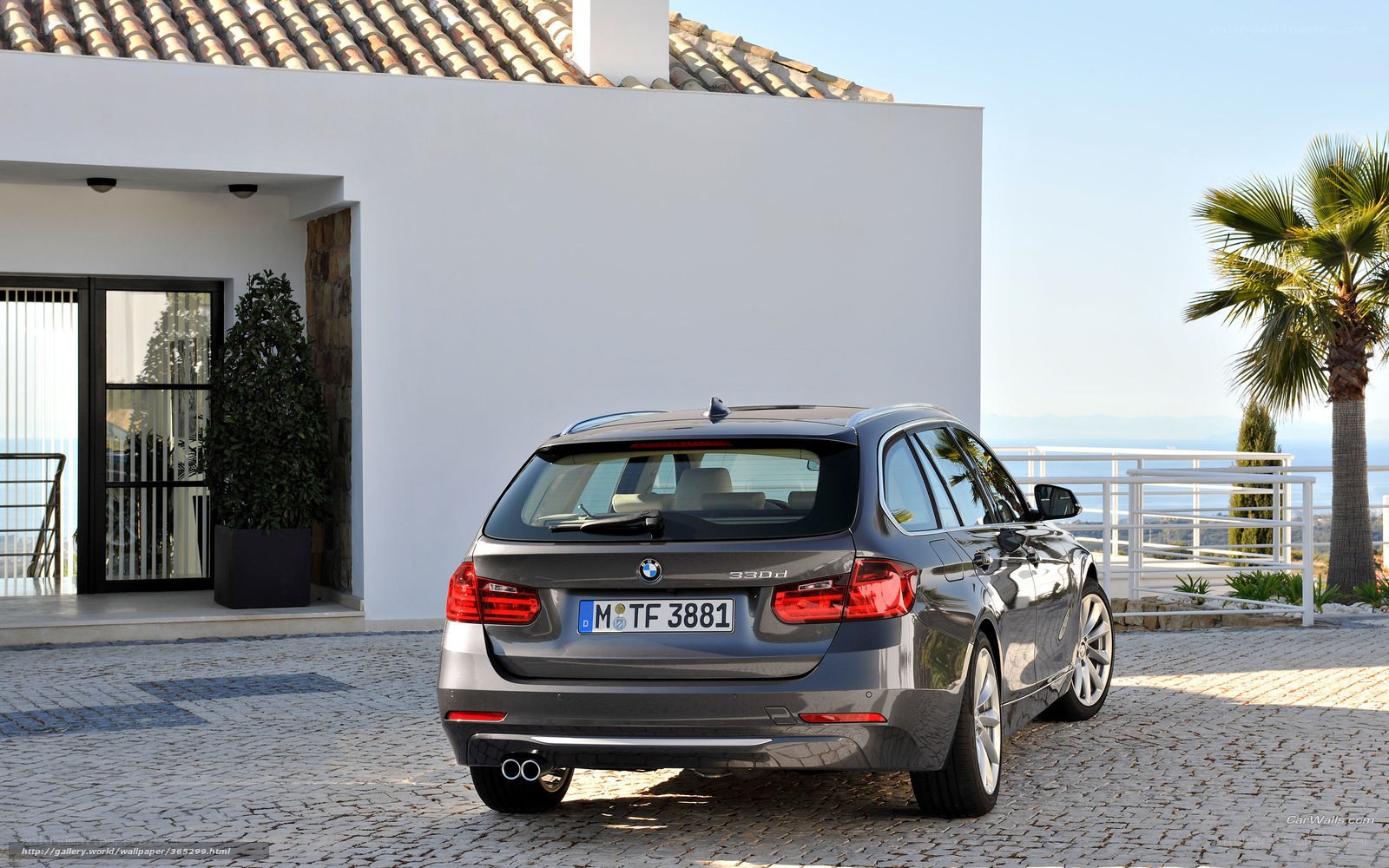 BMW 330d parked outside house