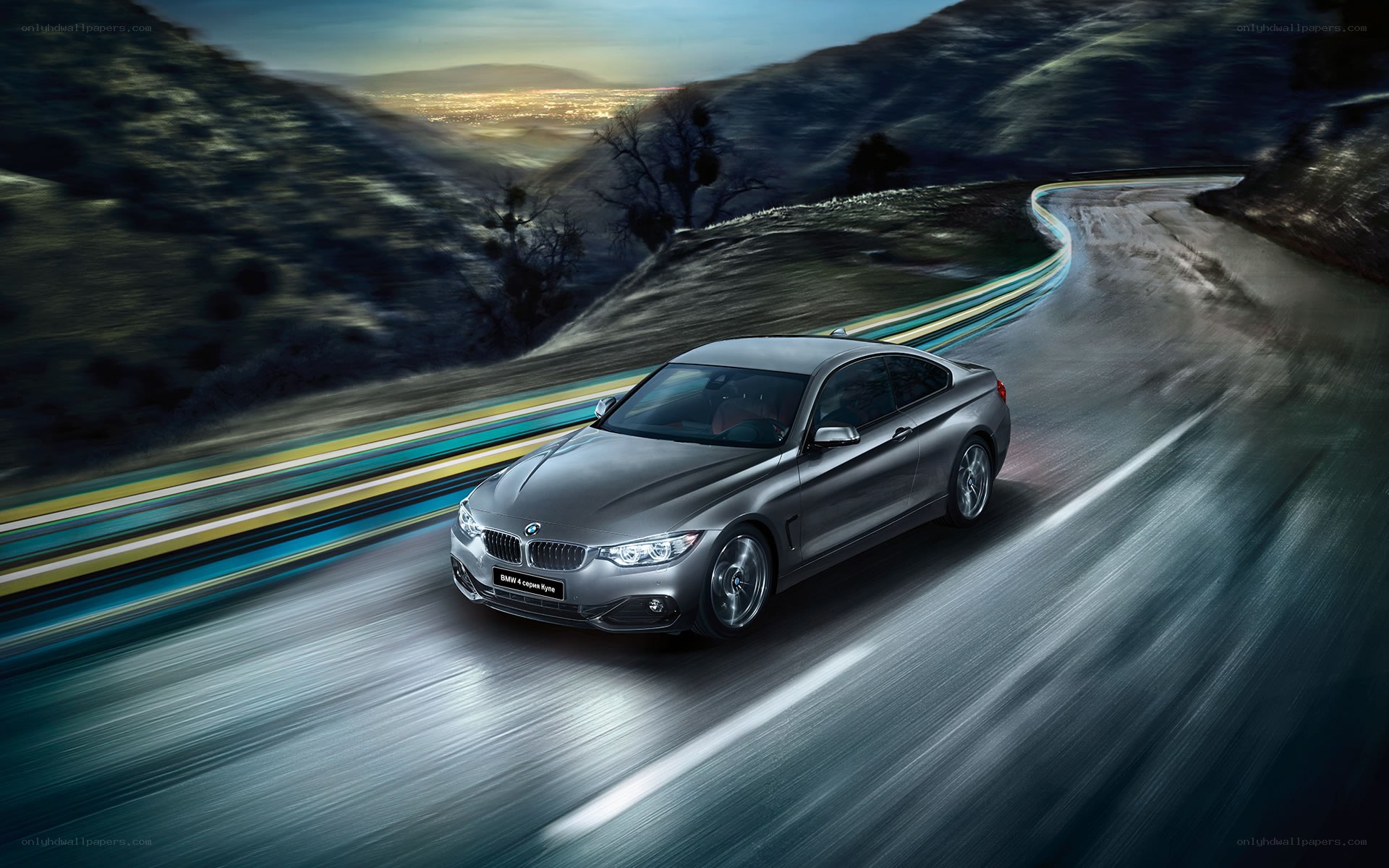 BMW 4 Series driving on winding road