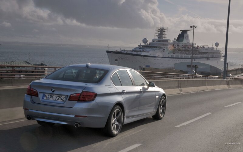 BMW 5 Series on coastal road