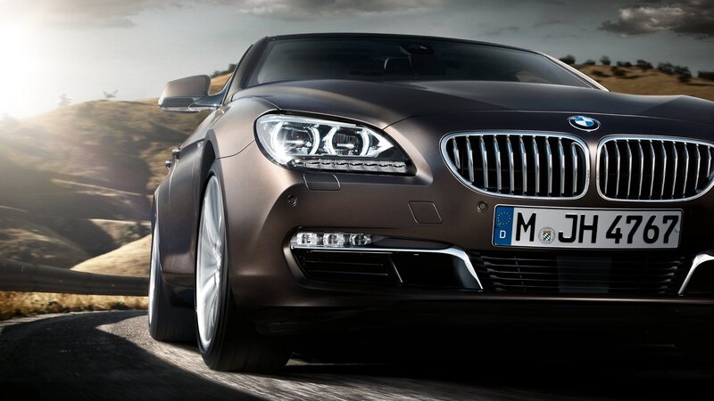 BMW 6 Series driving on a road