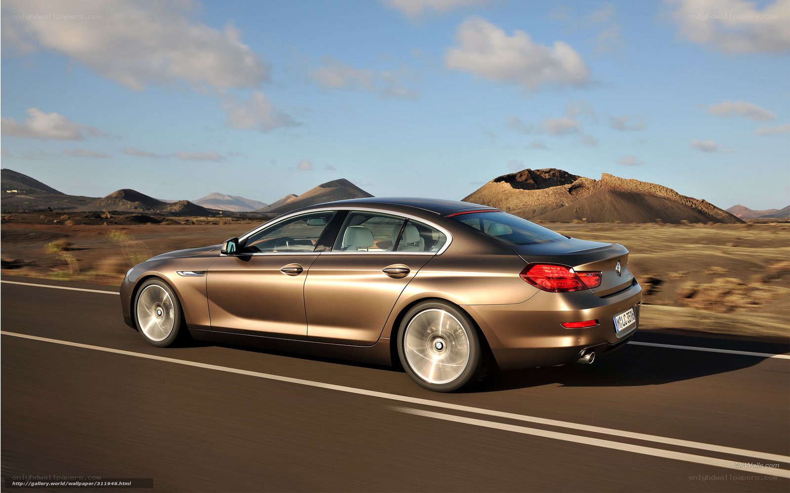BMW 6 Series driving on road