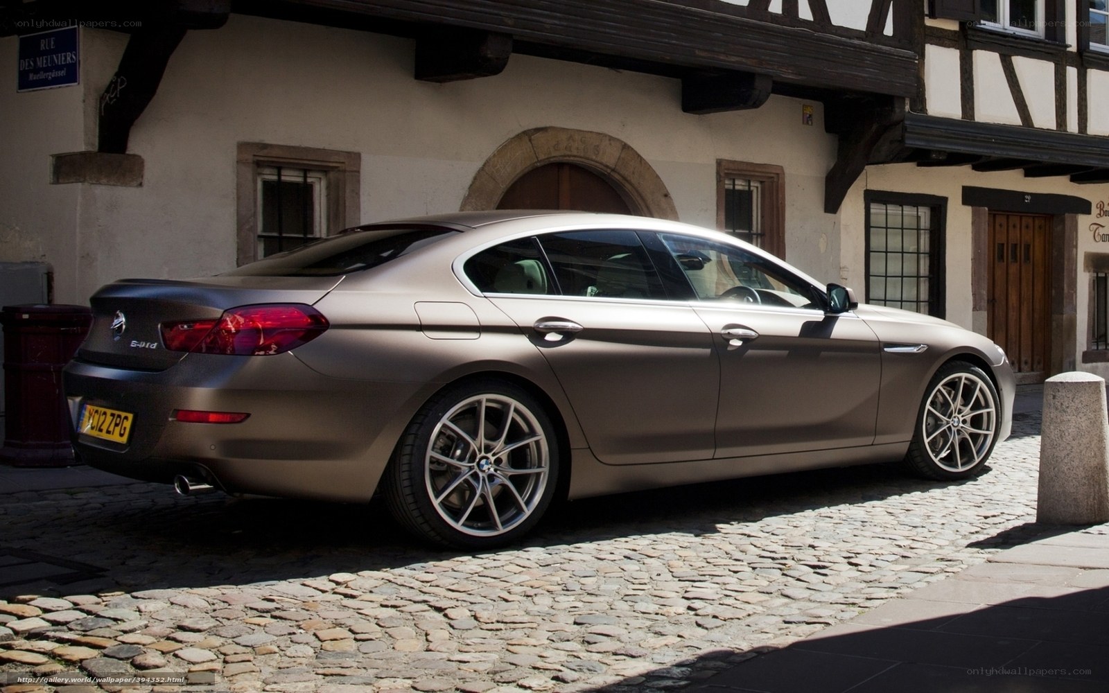 BMW 6-Series on cobblestone street