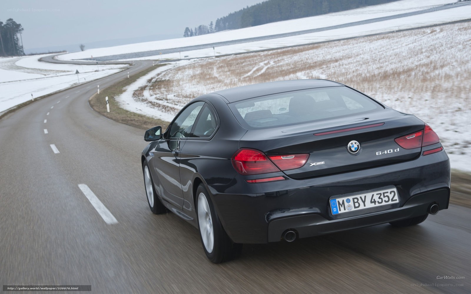 BMW 640d driving on a winter road