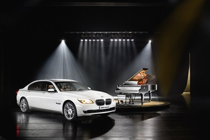 BMW and grand piano on stage