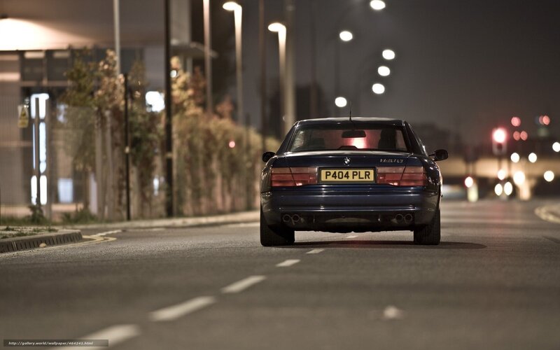 BMW at night on city street