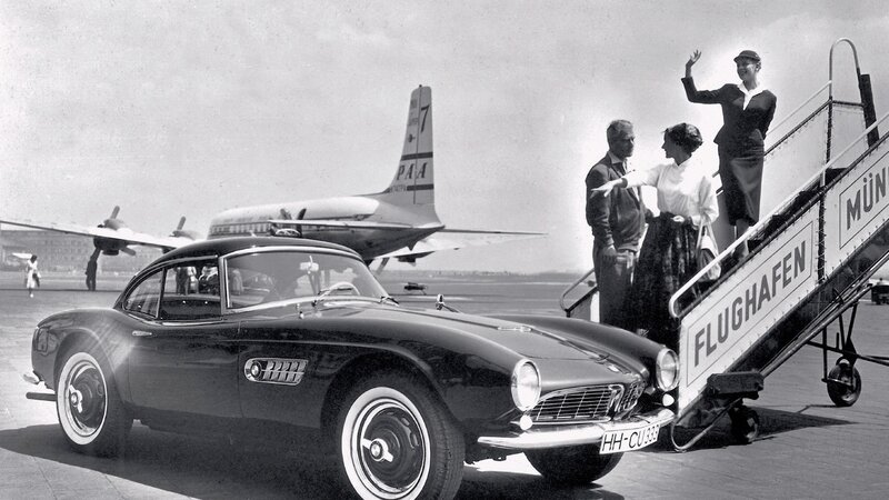 BMW car at airport with passengers