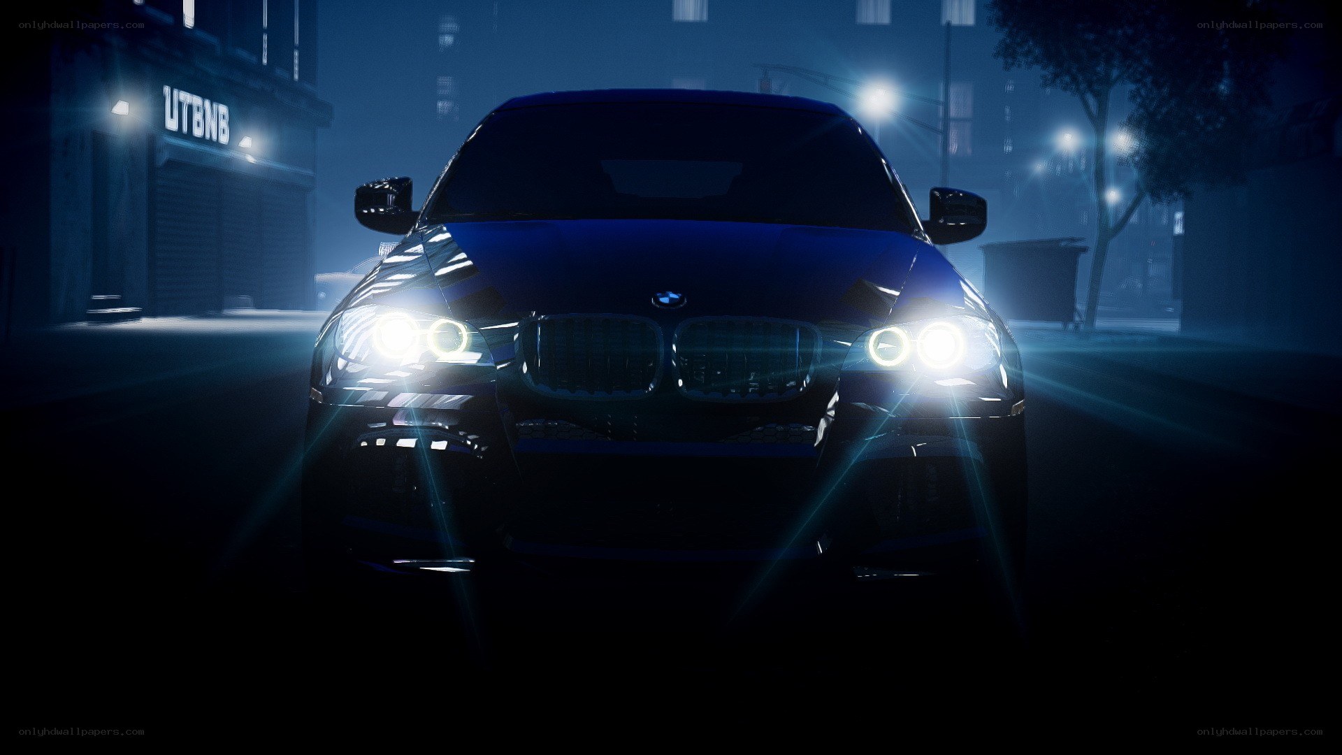 BMW car at night with headlights on
