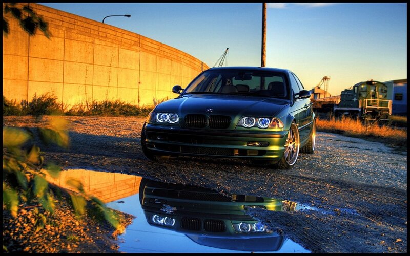 BMW car in sunset reflection