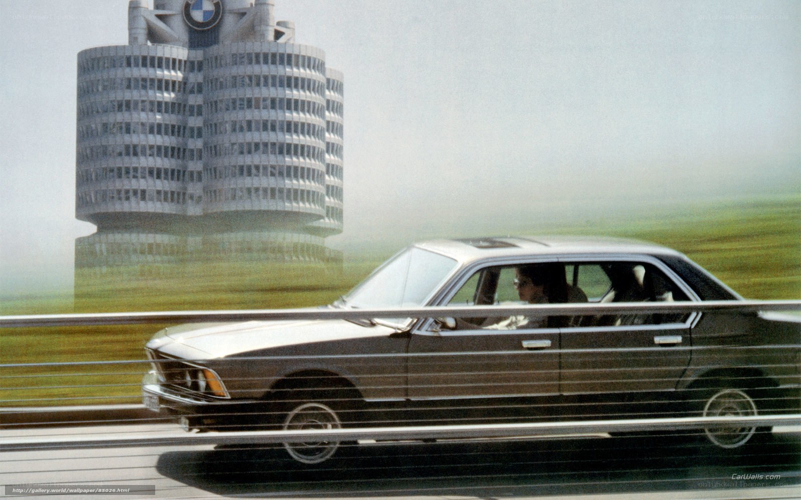 BMW car on highway with building