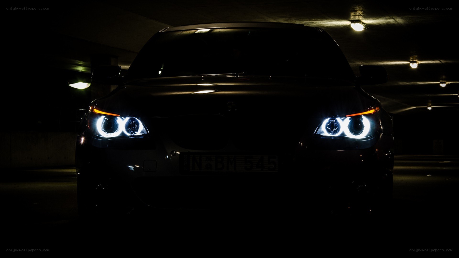 BMW car with headlights on