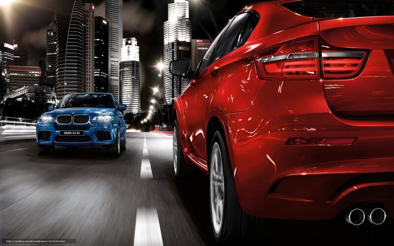 BMW cars in city at night