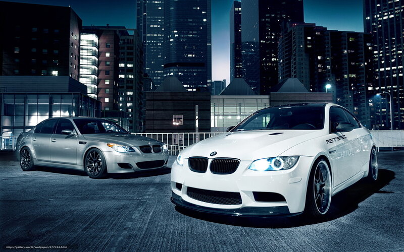 BMW cars in city at night