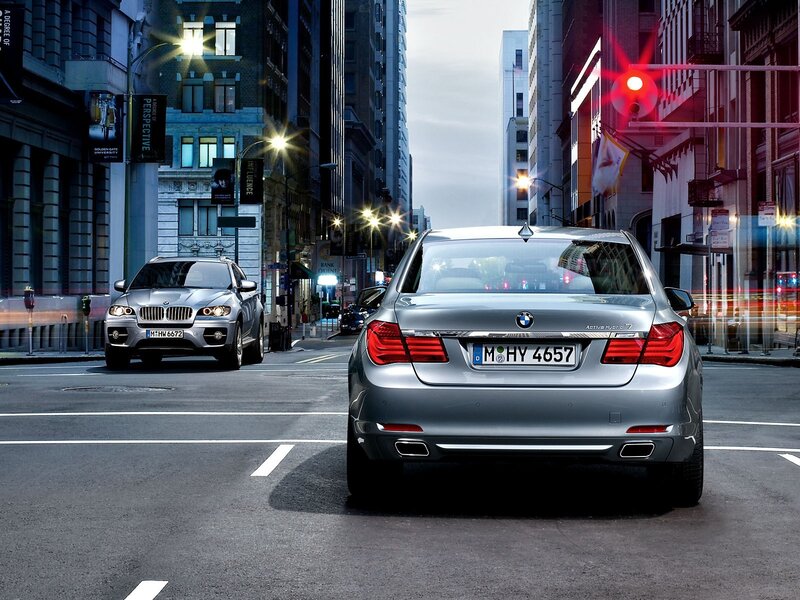 BMW cars in city street