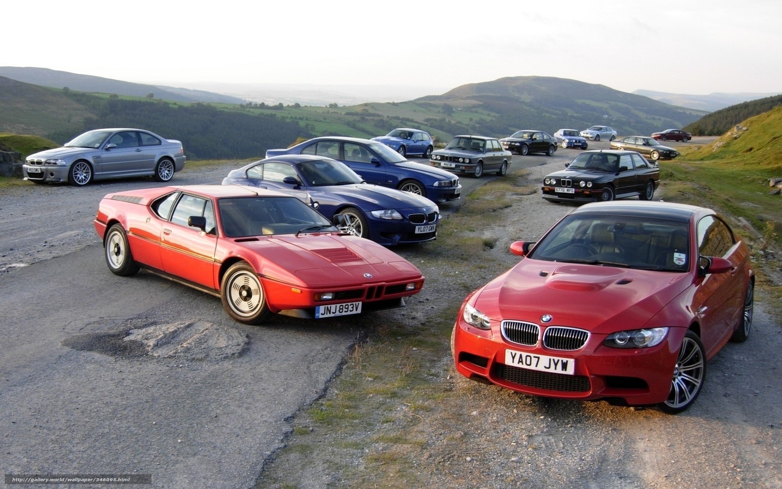 BMW cars on a hillside