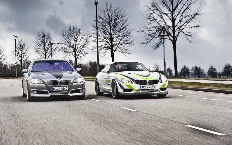 BMW cars on a road