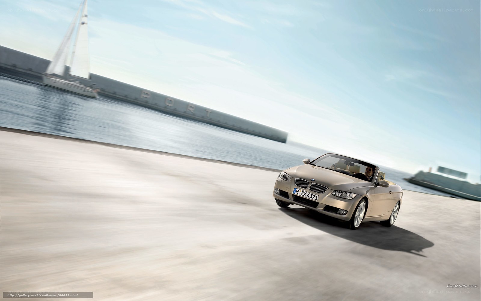 BMW convertible driving by the port