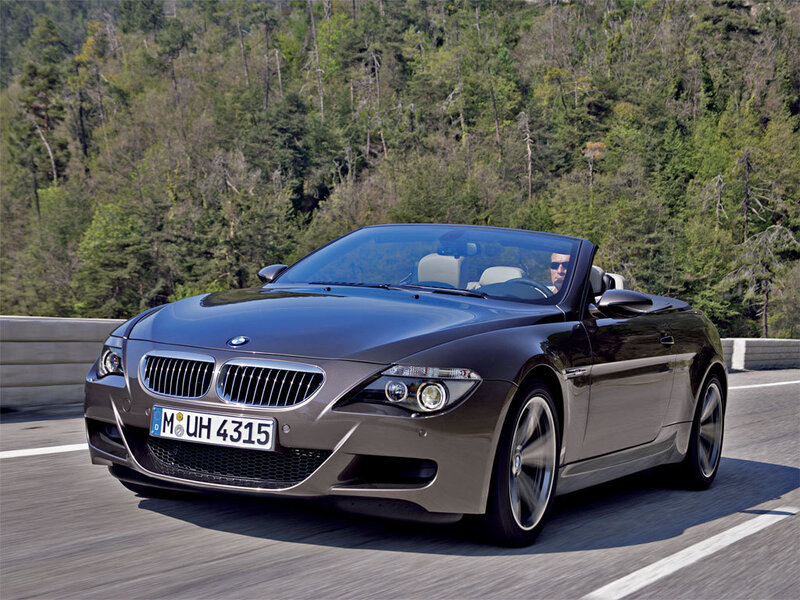 BMW convertible on a forest road