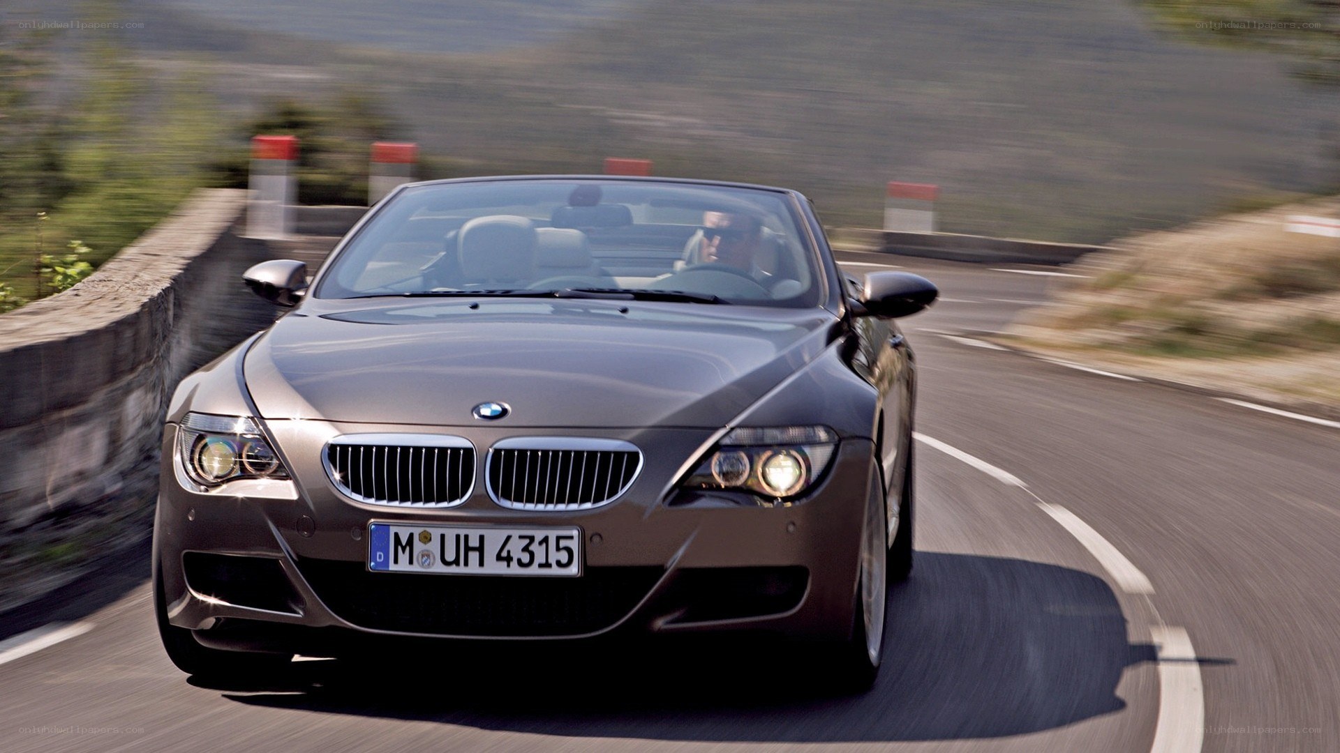 BMW convertible on winding road