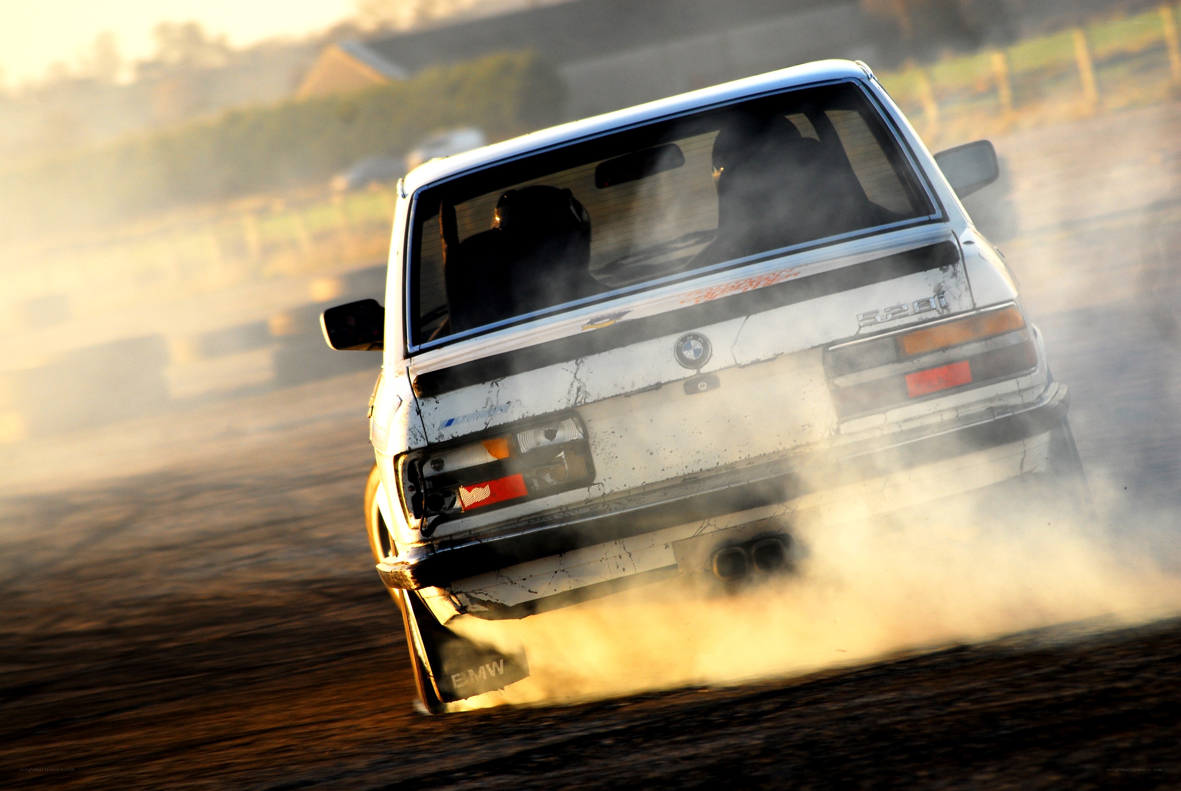 BMW drifting on dirt track