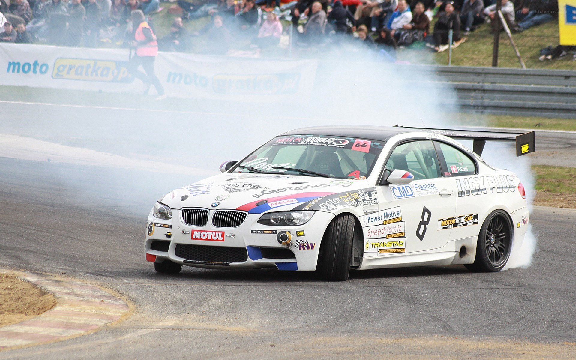 BMW drifts on racetrack