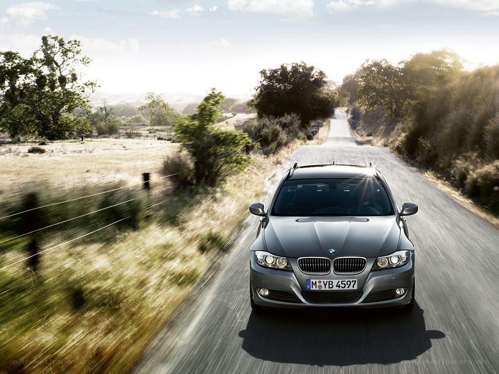 BMW driving on a country road