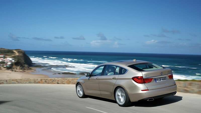 BMW driving on coastal road