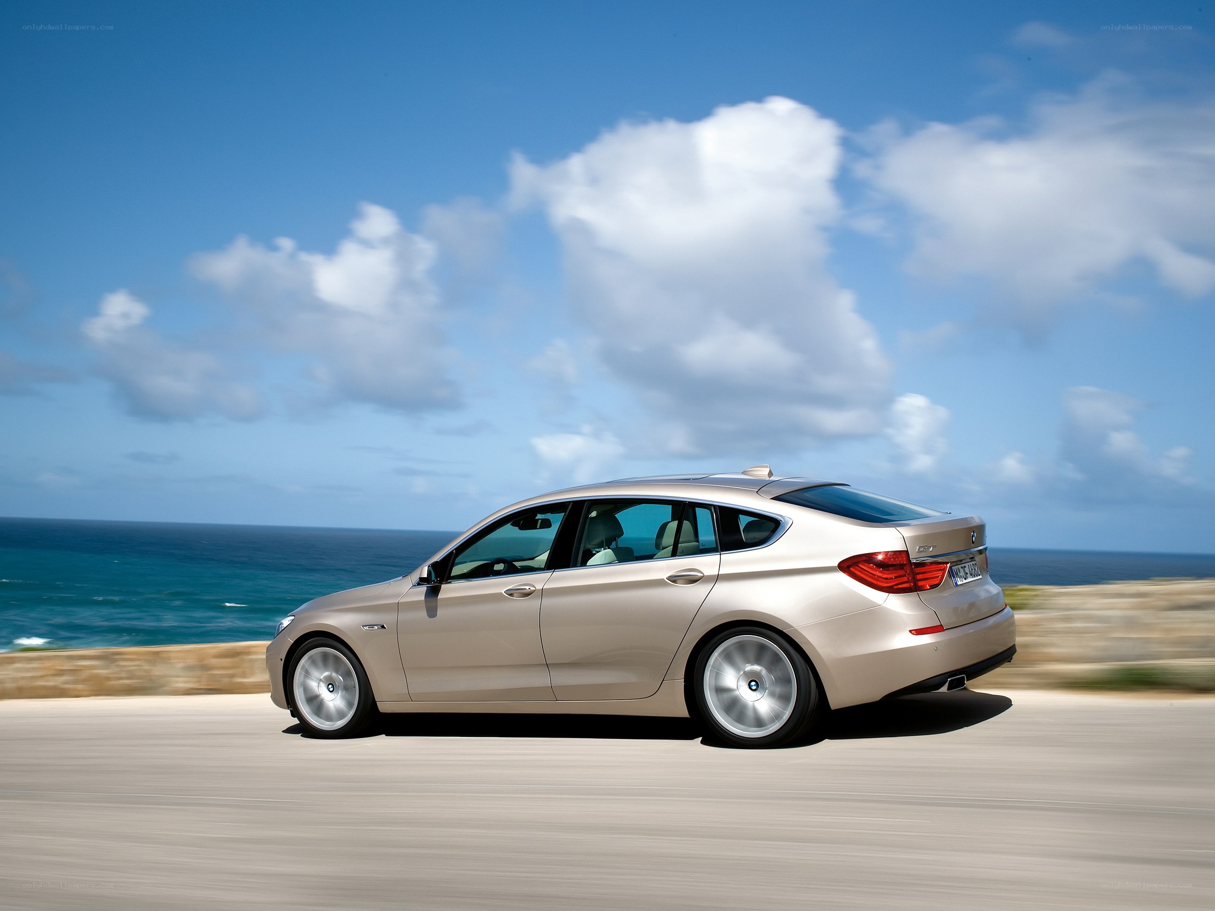 BMW driving on coastal road